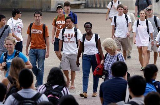 Students walk through the University of Texas at Austin campus in Austin. This giant flagship campus -- once so slow to integrate -- is now awash in color, among the most diverse the country if not the world. The student body, like Texas, is majority-minority. So is this the "critical mass" of minority students that U.S. Supreme Court narrowly endorsed in 2003 as an educational goal important enough to allow colleges to factor the race of applicants into admissions decisions? That question will be front and center Wednesday when a more conservative Supreme Court revisits affirmative action for the first time since that landmark case nine years ago involving the University of Michigan.