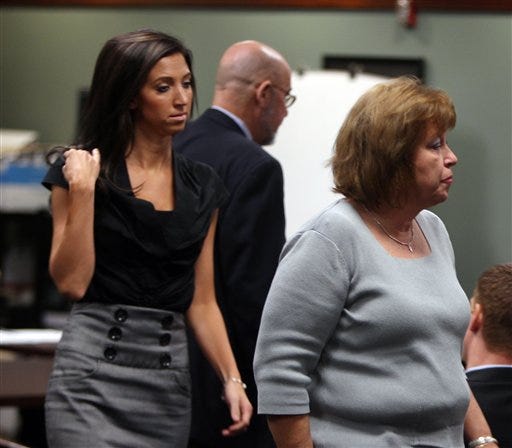 In a Monday, July 30, 2012, file photo, Sarah Jones, left, former Dixie Heights High School teacher and cheerleader for the Cincinnati Bengals, and her mother, Cheryl Jones leave Kenton Circuit Court in Covington, Ky., after a motion hearing on charges against Jones of first degree sexual abuse for allegedly having sexual contact with a 17-year-old student when she was a teacher. Kenton Circuit Judge Patricia M. Summe on Tuesday, Oct. 2, 2012 denied a request that text messages be thrown out in the case against Jones. She is facing a sex abuse charge. The trial is set to being on Oct. 10. Cheryl Jones is charged with tampering with evidence in the case.