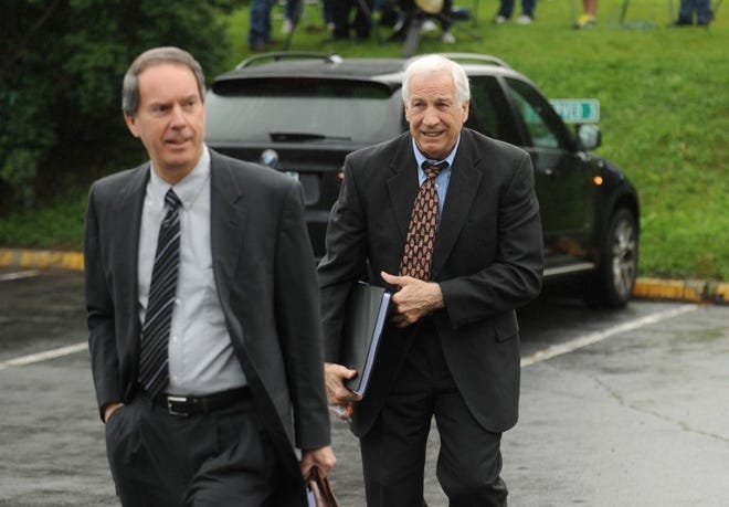 Jerry Sandusky, right, and his attorney Joe Amendola walk into the Centre County Courthouse, in Bellefonte, Pa., June 5. (AP Photo/Centre Daily Times, Nabil K. Mark)