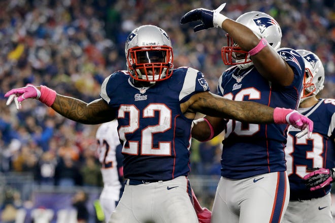 Running back Stevan Ridley celebrates his touchdown with tight end Daniel Fells (86) and wide receiver Wes Welker in the third quarter of the Patriots' 31-21 victory on Sunday afternoon at Gillette Stadium.
