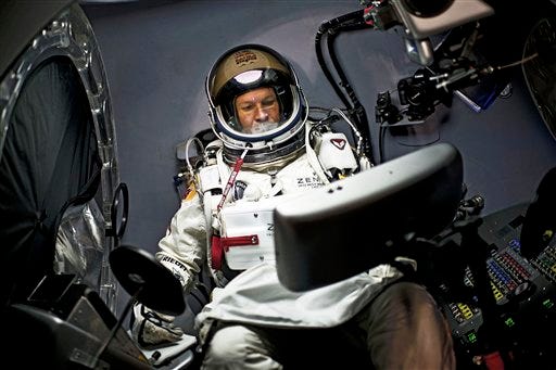 In a photo provided by Red Bull, pilot Felix Baumgartner of Austria, sits in his capsule during the preparations for the final manned flight of the Red Bull Stratos mission in Roswell, N.M. on Saturday, Oct. 6, 2012.