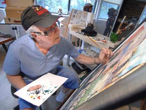 Ford Smart works on one of his paintings at his home. He has been painting as a hobby ever since he can remember.