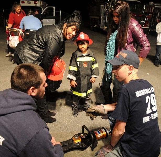 Fire companies from Marshalls Creek, Shawnee and Bushkill were at Shawnee Mountain and Ski area last year. Here Christopher Baez, 5, of Marshalls Creek, checks out some Jaws of Life equipment with Marshalls Creek firemen Jerry Grafal, right, and Mike White. Christopher's mom Kimberly, right, and Grandma Estelle look on.