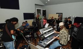 Amarillo-area musicians rehearse in July for a presentation of Pink Floyd's album "Dark Side of the Moon" to benefit Texas Music for Life. The musicians will repeat their efforts Saturday in the Amarillo Civic Center Auditorium.