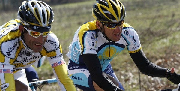 FILE - This March 21, 2009 file photo shows Lance Armstrong, of the United States, beside fellow countryman George Hincapie, left, during the Milan-San Remo cycling classic in San Remo, Italy. The U.S. Anti-Doping Agency says 11 of Lance Armstrong's former teammates testified against him in its investigation of the cyclist, revealing "the most sophisticated, professionalized and successful doping program that sport has ever seen."