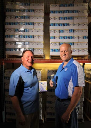 Bruce.Lipsky@jacksonville.com--09/04/12--Peter Hayes, (L) president, and Jeff Brudos, COO, pose in the Full Core distribution warehouse in Tuesday, September 4, 2012, on Jacksonville, FL. On the can of the lemon-lime flavor drink it says, "Full Core is a natural appetite control drink that promotes digestive health." (Florida Times-Union, Bruce Lipsky)