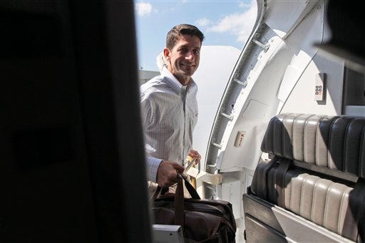 Republican vice presidential candidate, Rep. Paul Ryan, R-Wis., boards the campaign charter flight at the Clearwater International airport on Wednesday in Clearwater, Fla.