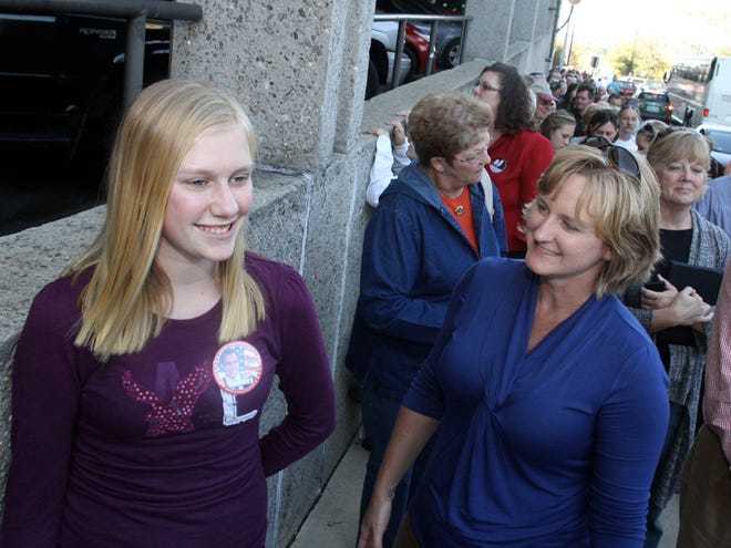 MacKenna Williams, daughter of former county Commissioner Mark Williams, waited in line on Rankin Avenue with her mom and dad to see Mitt Romney.