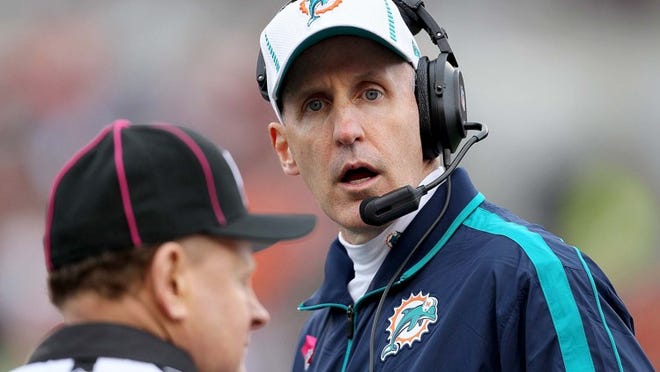 Miami Dolphins head coach Joe Philbin challenges a ruling on the field that looked like a touchback on a punt in the fourth quarter at Paul Brown Stadium in Cincinnati, Ohio on October 7, 2012. The call was not overturned.(Allen Eyestone/The Palm Beach Post)