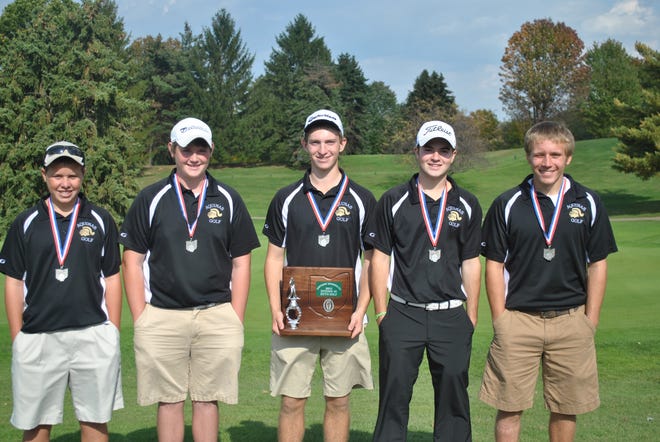 The state-bound St. Thomas Aquinas golf team, with its district runner-up trophy, features (from left) Jason Barnett, Alex Miday, Daniel Mosher, Patrick LaLiberte and Jake Stauffenger.