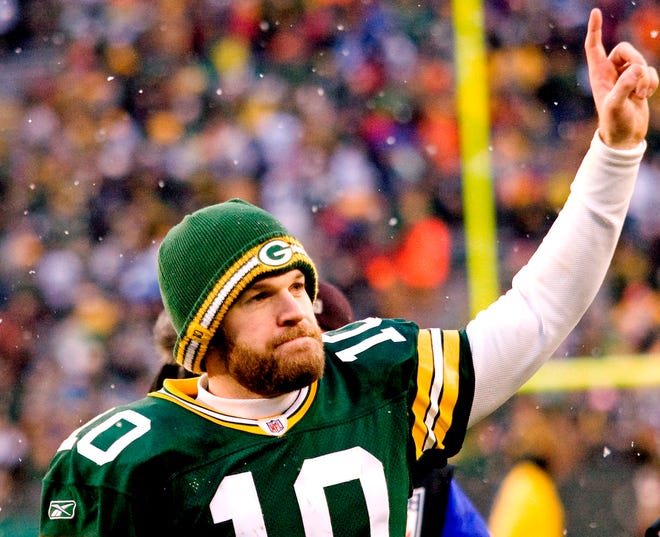 Green Bay Packer quarterback Matt Flynn gestures as he exits the field after defeating the Detroit Lions 45-41 in an NFL football game at Lambeau Field in Green Bay, Wis., on Sunday, Jan. 1, 2012. Aaron Rodgers got to rest up for the playoffs and backup Matt Flynn threw for a franchise-record six touchdowns, the final one to Jermichael Finley with 1:10 left, giving the Packers a 45-41 victory over the Lions.
