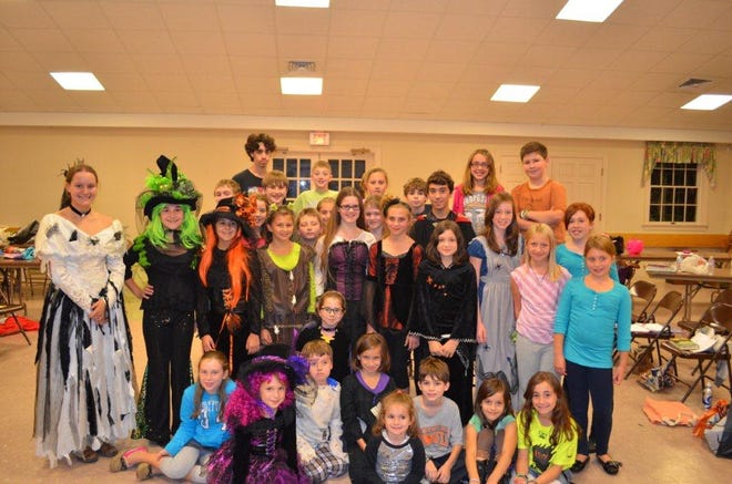 The cast of Little Folks Theatre's original production of "Monster Bash" rehearses last week in Dighton.