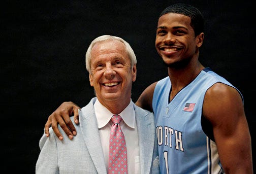 North Carolina coach Roy Williams, left, poses with Dexter Strickland during the Tar Heels' media day.
