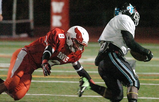 Milford's John Hearns tries to catch Holy Name's Quron Wright on Friday in Milford.