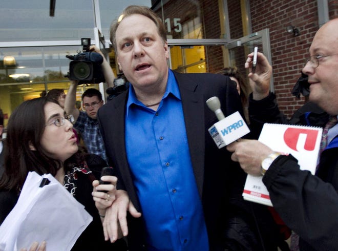 FILE - In this May 21, 2012 file photo, former Boston Red Sox pitcher Curt Schilling, center, departs the Rhode Island Economic Development Corporation headquarters in Providence, R.I., after he met with the agency to discuss the finances of his troubled video company. The government deal that guaranteed a $75 million loan for Schilling's 36 Studios focused almost exclusively on how quickly the firm would bring jobs to Rhode Island and overlooked requirements for attracting outside investment or other steps that could have helped protect the public’s money.