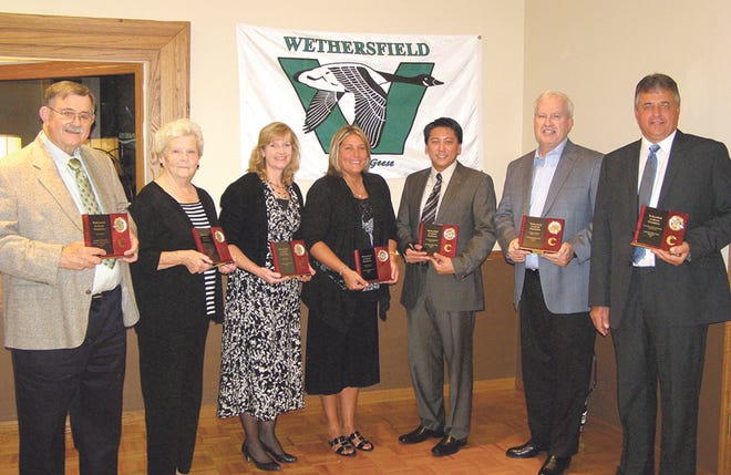 Inducted into the Wethersfield Academic Hall of Fame at a banquet Saturday night at The Kewanee Dunes were, from left, retired staff members Milt Carlson and Marilyn Lindstrom Humphrey; Cindy (Fouser) Simmons, representing her sister, inductee Laura Fouser; Heidi Heinrich, representing her brother, inductee Rick Heinrich; and inductees Dr. Sherwin Parungao, Gregory W. Moss and Larry Shimmin.