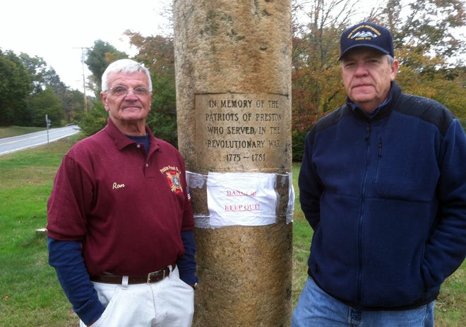Preston Memorial Committee Secretary Ron Tanguay, left, and Treasurer Mark Christensen stand next to the town's Revolutionary War