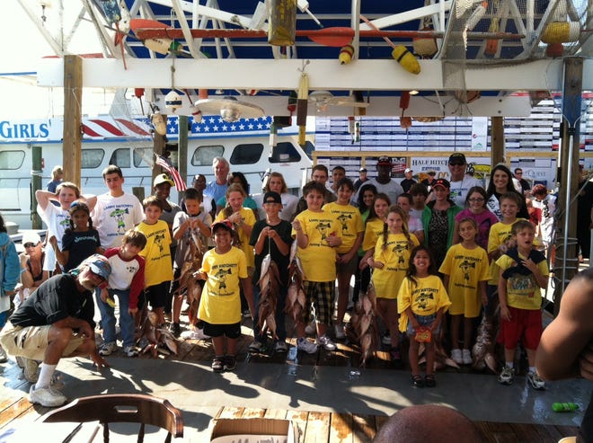 The Larry Hatchett Fishing Foundation after their 22nd fishing trip during the 64th-Annual Destin Fishing Rodeo.