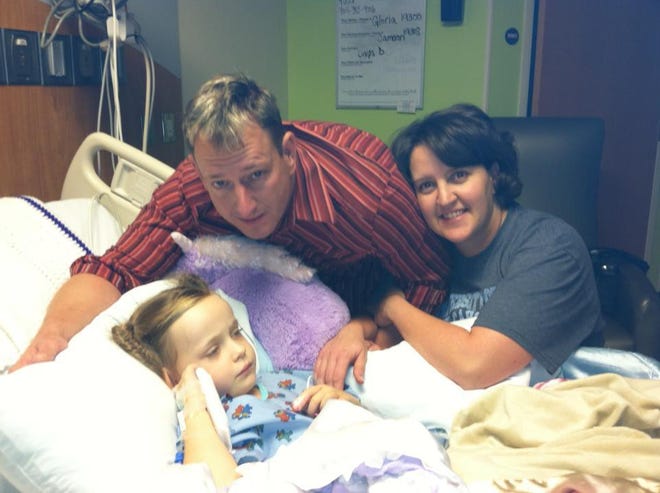 Hannah Roberts of Bessemer City continues to battle infection at Levine Children's Hospital, alongside her parents, Mike and Tracy Roberts.