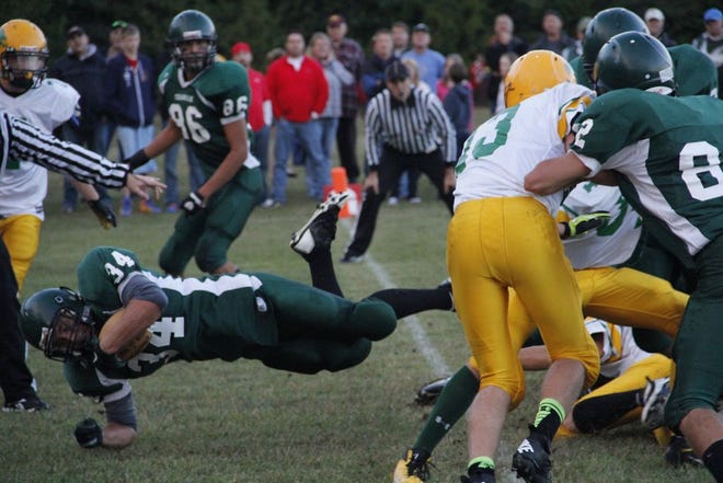 Kaden Barbeaux scores a touchdown in a game against Engadine at DeTour.