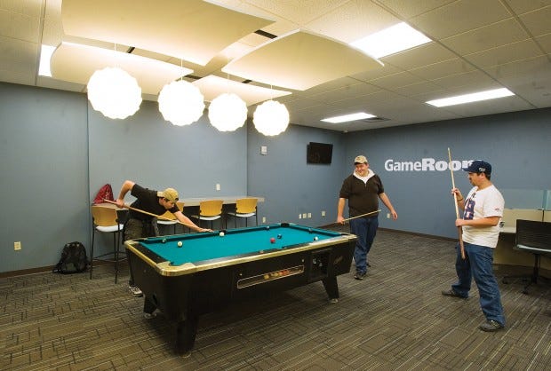 Matt Thibodeau (left) along with Robert Van Auken (center) and Adam Murphy play a game of pool in the new Student Center Game Room. Chieftain photo John Jaques 10.15.12