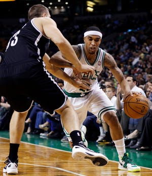 Celtics guard Courtney Lee (right) drives against Brooklyn's Mirza Teletovic during the first half of Tuesday night's preseason game at TD Garden.