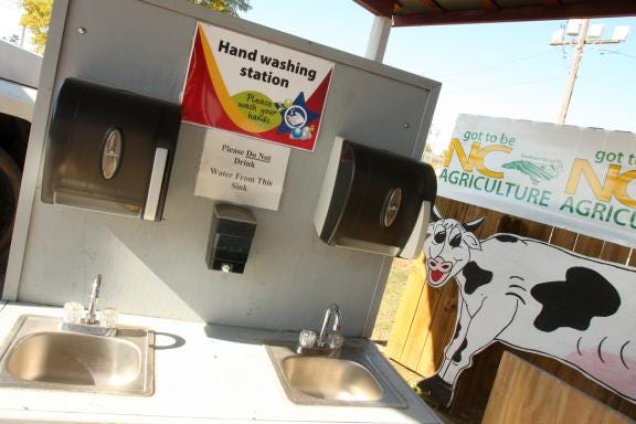 The fairgrounds operated hand-washing stations near the animal areas, but health officials have said there are reports of inconsistent hand-washing during the fair.