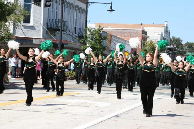 A cheer squad leads the Marching Bulldogs.