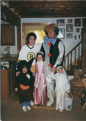 Halloween was Noreen Deady’s favorite holiday. She is wearing a Boston Bruins jersey in this picture taken 15 years ago. With her are her husband, John, and their three children, from left, Courtney, Kelly and Crystal. Noreen died in April.