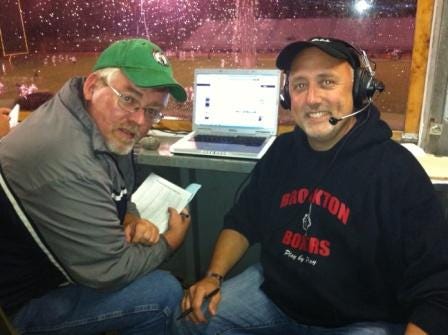 Bob Buckley, left, and Bill Carpenter in the broadcast booth at Rocky Marciano Stadium for Friday's night's soggy game between Brockton High and St. John's Prep.
