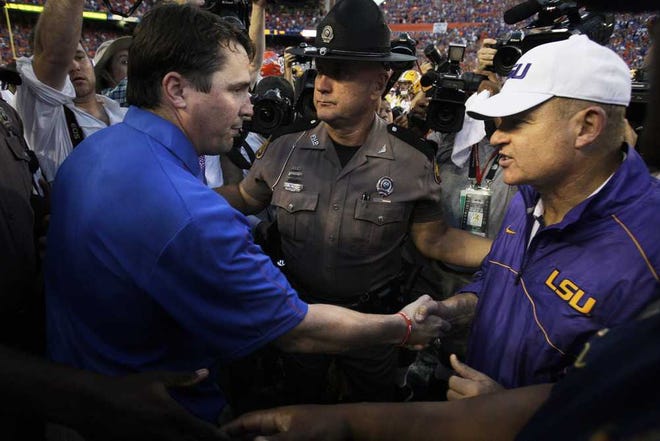 Will Vragovic Tampa Bay Times  UF coach Will Muschamp (left) and LSU coach Les Miles will meet at midfield after their game next season too. The Gators and Tigers have met every season since 1971.