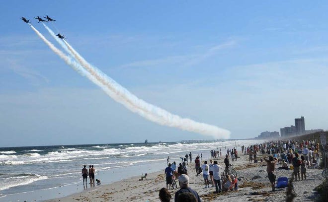 Bob.Mack@Jacksonville.com In this photo from the 2009 Sea & Sky Spectacular, The Blue Angels fly over the Beaches as people gather on the beach at the end of Atlantic Boulevard.