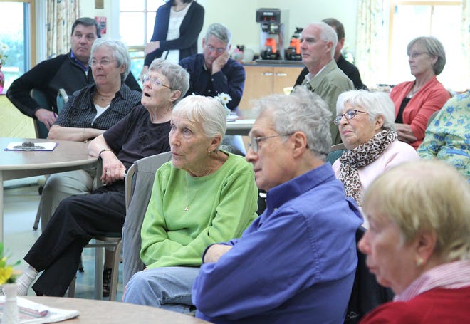 At the Marshfield Senior Center, residents listen as Attorney General Martha Coakley outlines current scams being used to victimize the elderly. Joining Coakley at the event, held on Thursday, Oct. 18, 2012, was state Rep. James Cantwell.
