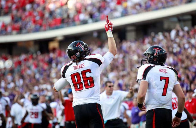 Texas Tech's Alex Torres celebrates a touchdown against TCU with Seth Doege during their game on Saturday in Fort Worth.