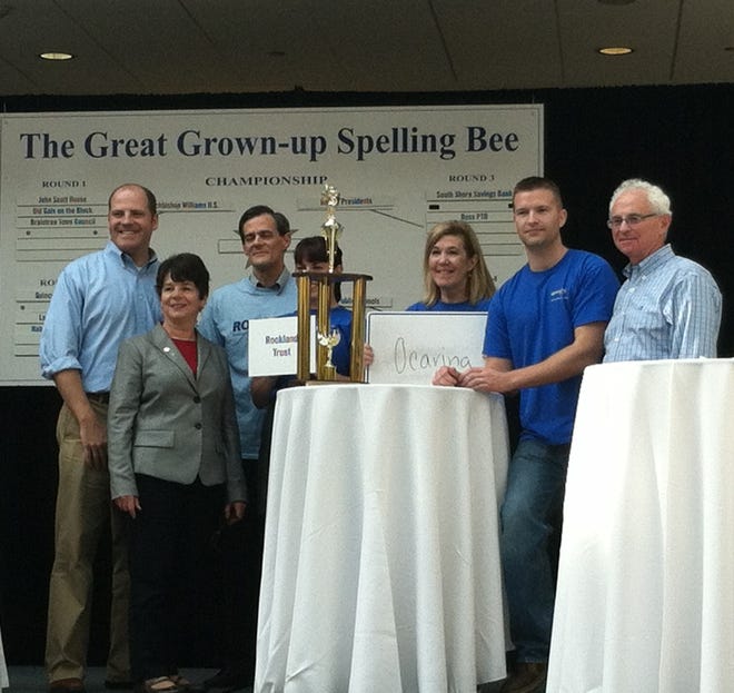 Members of the Rockland Trust team stand with their trophy at the Great Grown-Up Spelling Bee. The event was sponsored by the Braintree Rotary Club and the South Shore plaza to raise money for the club.