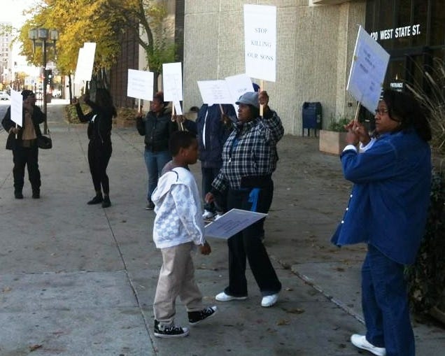 A small group gathers outside the Public Safety Building on Saturday, Oct. 20, 2012 to support Logan Bell, who was shot and killed by police Oct. 11.