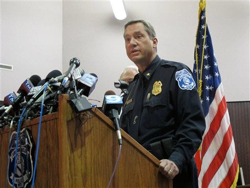 Brookfield Police Chief Dan Tushaus briefs reporters in an evening news conference in Brookfield, Wis., on Sunday, Oct. 21, 2012. A man who had been accused of domestic violence and slashing his wife's tires took a gun into the spa where she worked and shot seven women, three fatally, before killing himself, Tushaus said. The shootings set off a confusing, six-hour search Sunday for the gunman that locked down a nearby mall, a country club adjacent to the spa and the hospital where the survivors were taken. (AP Photo/Carrie Antlfinger)