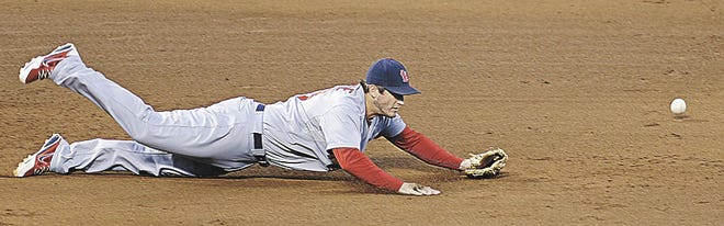Associated Press St. Louis third baseman David Freese can't come up with a ball hit by Hunter Pence in the fifth inning.