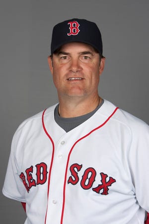 This 2010 photo shows Boston Red Sox pitching coach John Farrell. The Red Sox announced Sunday that John Farrell will be their new manager after being traded from the Toronto Blue Jays.