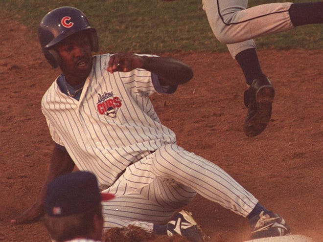 Daytona Cubs outfielder Bo Porter slides into a base in 1995 against the Kissimmee Cobras, a Houston Astros affiliate. Seventeen years later, Porter was introduced as the manager of the Houston Astros.