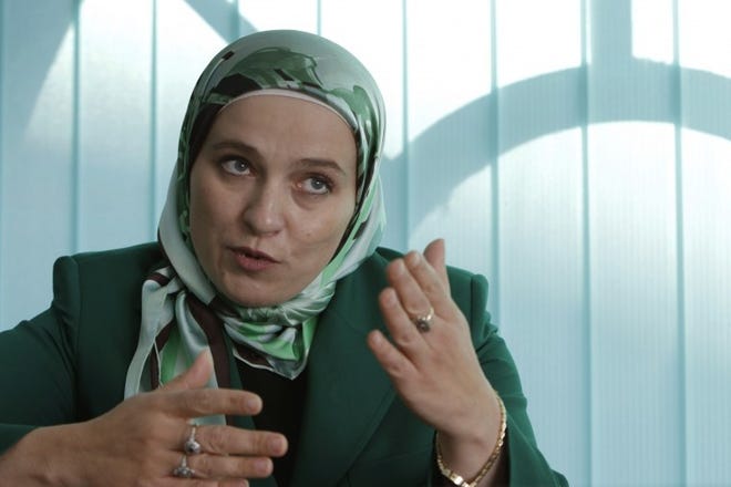 Amra Babic is the first woman to wear a hijab as mayor of Vosoko, Bosnia, and possibly the only official in Europe to do so. She says this proves Muslim tradition is compatible with Western democratic values.