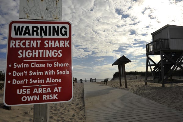 ORLEANS – 10/24/12 – Just down the street from a morning meeting at Orleans Town Hall about the increase in sharks off Cape Cod, a sign is posted at the entrance to Nauset Beach warning of dangerous marine animals. 
102412sh07