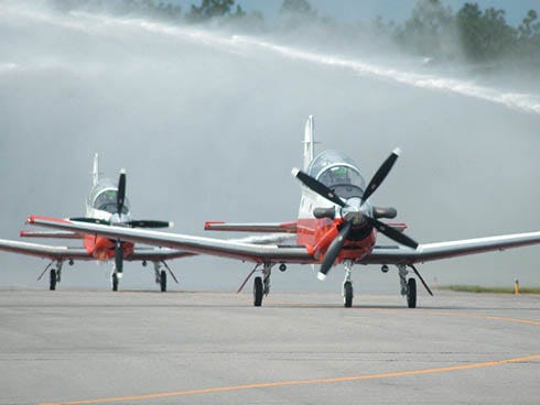 This 2009 file photo shows the arrival of T-6B trainers as they taxi to a hanger on NAS Whiting Field in Santa Rosa County.