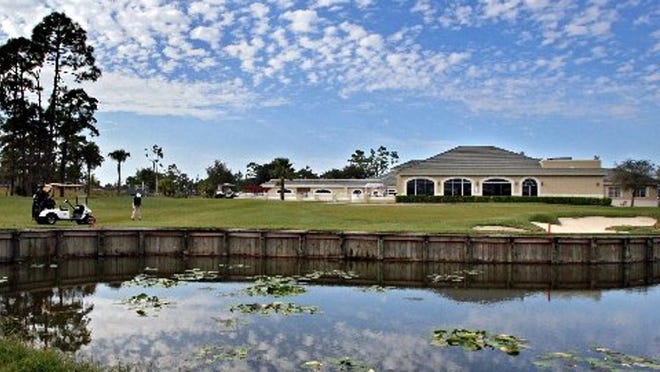 The 18th green in front of the refurbished clubhouse at Binks Forest Golf Club in Wellington. (Allen Eyestone/Palm Beach Post 2008 file photo)