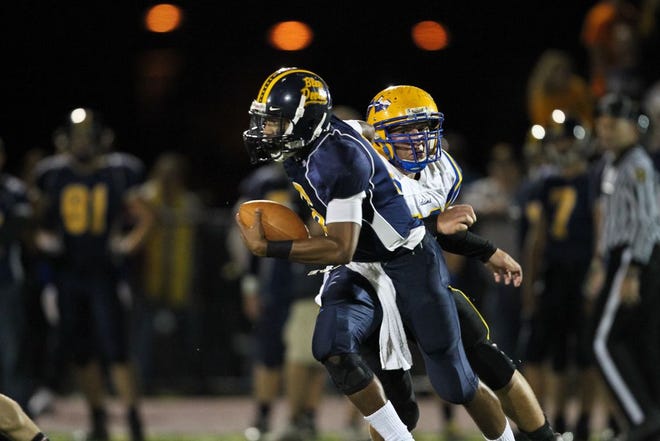 Greencastle-Antrim's Austin Scott (with ball) is pursued by Waynesboro's Andrew Paterno (right) during a varsity football game at Kaley Field on Sept. 30, 2011. Both Scott and Paterno will be on the field when G-A and Waynesboro renew their rivalry Friday night at 7:30 p.m. (BOB STOLER/THE RECORD HERALD)