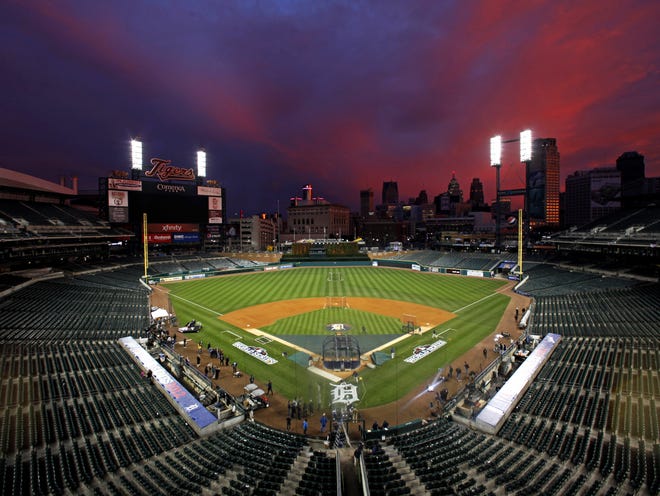 Colorful clouds are illuminated at sunset over Comerica Park in Detroit on Friday. The Detroit Tigers host the San Francisco Giants in Game 3 of baseball's World Series on Saturday. The Giants lead the best-of-seven series 2-0.