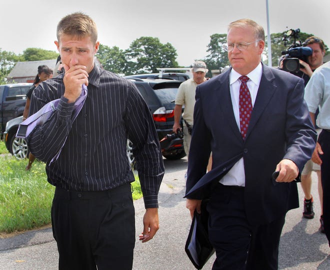 Attorney Gregory Sullivan, right, escorts client Justin McDonald, of Marshfield, as they leave Plymouth District Court, Monday, July 18, 2011. McDonald is charged in connection with boat accident that killed his friend, Steven "Zac" Woods of Marshfield.