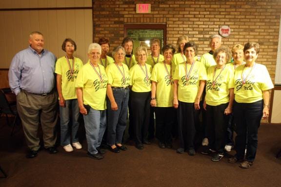 The Golden Girls' Softball Team brought home the gold for the fourth consecutive year from the N.C. Senior Games Finals in Raleigh. Team members and coach are, front row, from left, Hester Haynes, Helen Thrift, Margaret Edwards, Harriett Wilson, Judy Latham, Lib Hamrick (scorekeeper) and Ann McSwain; and back row, Coach Steve Phillips, Priscilla Wray, Shirley Broughton, Diane Singleton, Stella Roberts, Linda Julian, Betty White and Becky Pruitt. Not pictured are Blandine Tate and Myrtle Ridge.