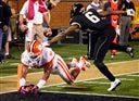 Clemson’s Brandon Ford, left, dives into the end zone past Wake Forest’s Chibuikem Okoro on Thursday night.