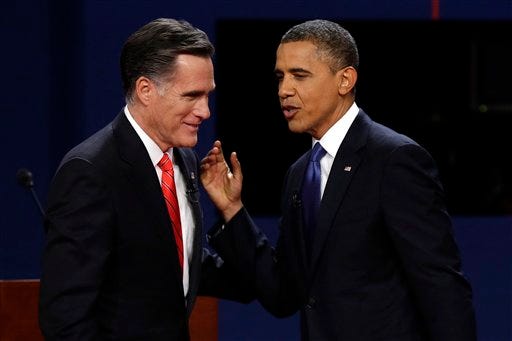 In this Oct. 3 file photo, Republican presidential candidate, former Massachusetts Gov. Mitt Romney and President Barack Obama talk after the first presidential debate in Denver.